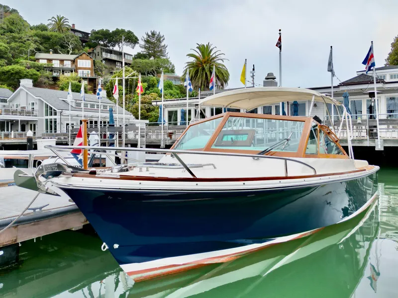 The Image of 2019 Hunt Yachts Harrier 26 cruising on water, sleek design. - 0