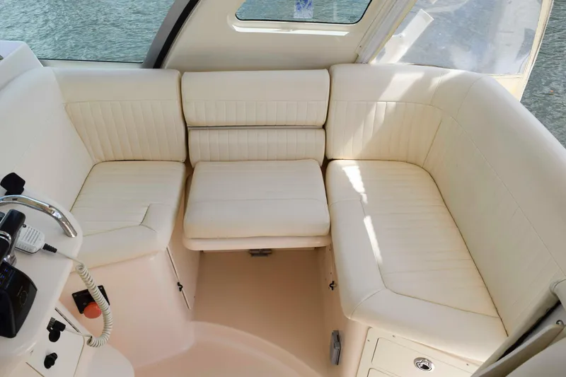 Slide: The Image of Luxurious seating area on 2012 Grady-White Express 360 boat interior. - 15