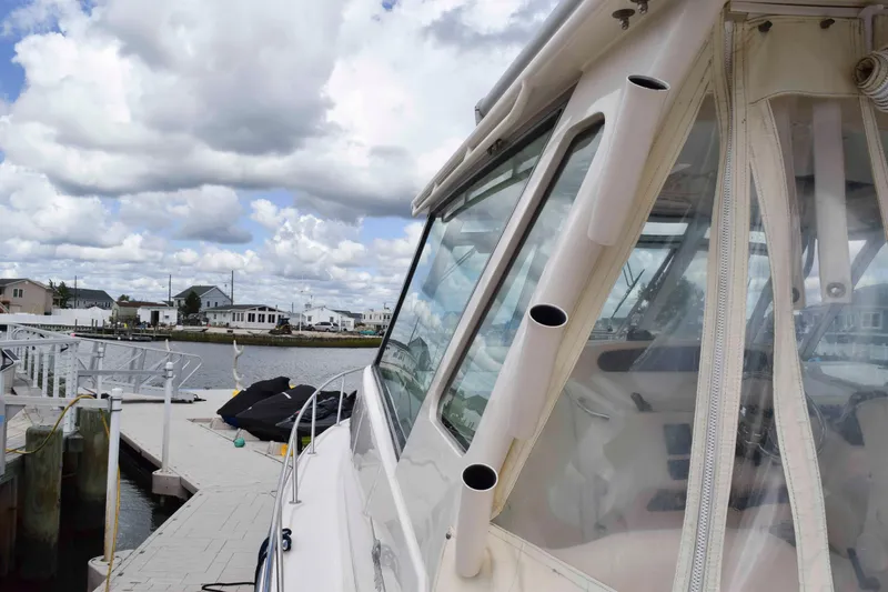 Slide: The Image of 2012 Grady-White Express 360 boat docked under cloudy skies. - 19
