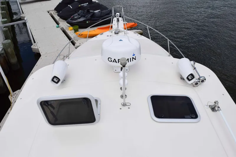Slide: The Image of 2012 Grady-White Express 360 boat deck with Garmin equipment, docked by the water. - 20