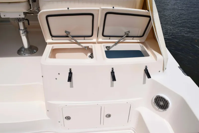 Slide: The Image of 2012 Grady-White Express 360 boat deck with open storage compartments. - 21