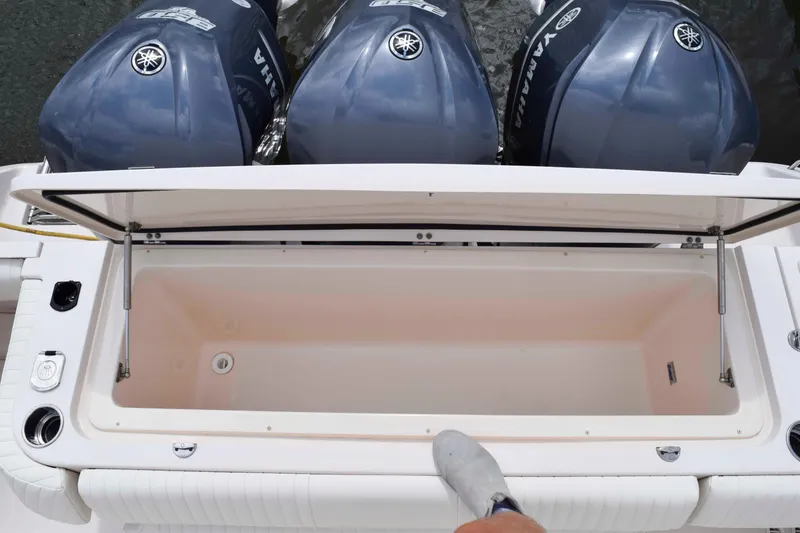 Slide: The Image of 2012 Grady-White Express 360 boat with open storage compartment and Yamaha outboard engines. - 23