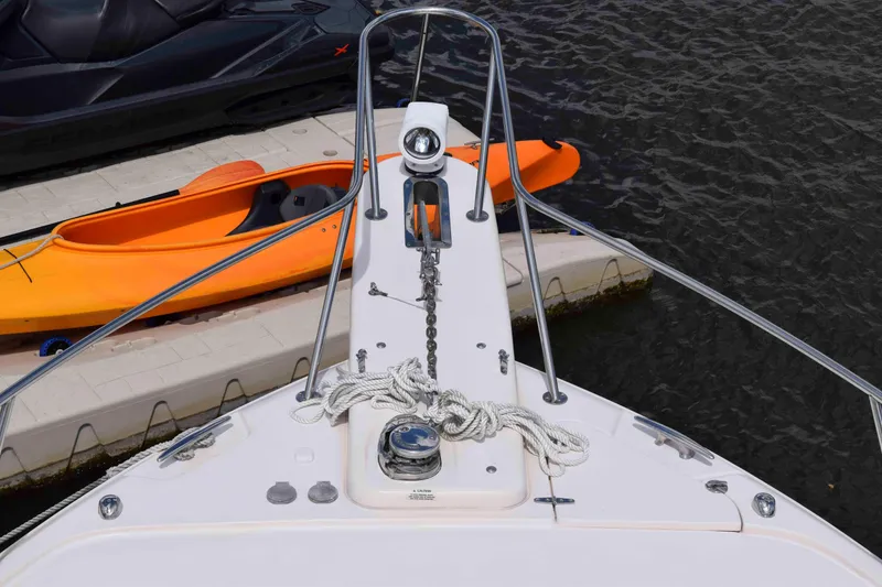 Slide: The Image of Bow view of 2012 Grady-White Express 360 with docked kayak and jet ski. - 25