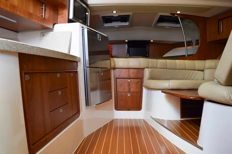 Slide: The Image of Luxurious interior of 2012 Grady-White Express 360 boat with wood cabinetry and leather seating. - 28