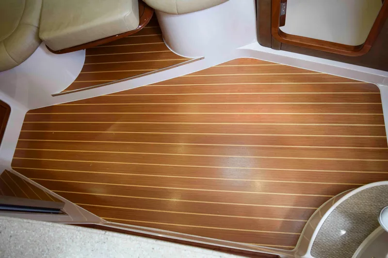 Slide: The Image of 2012 Grady-White Express 360 interior with elegant wood-patterned flooring. - 30