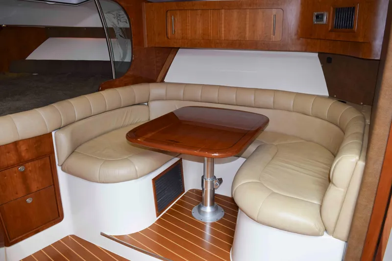 Slide: The Image of Luxurious interior of 2012 Grady-White Express 360 with leather seating and wooden table. - 31