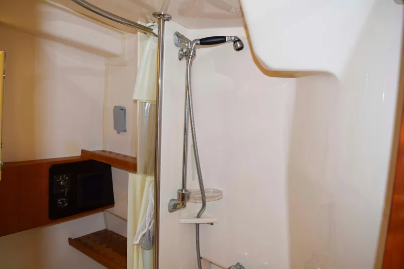 Slide: The Image of Shower area in 2012 Grady-White Express 360 boat with modern fixtures. - 35