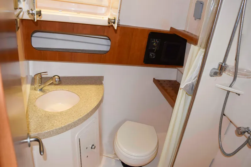 Slide: The Image of 2012 Grady-White Express 360 boat bathroom with sink, toilet, and shower. - 36