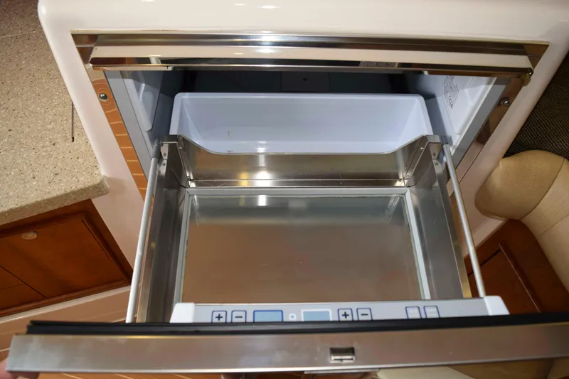 Slide: The Image of 2012 Grady-White Express 360 boat interior with open stainless steel drawer. - 37
