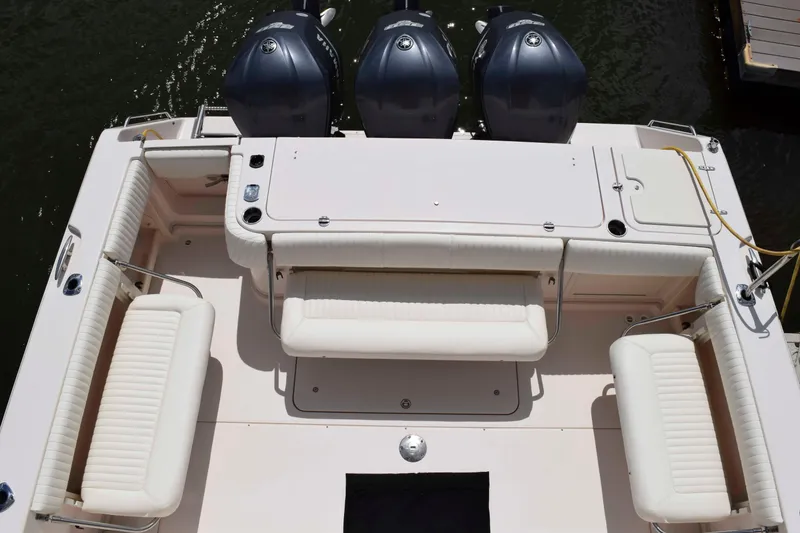 Slide: The Image of 2012 Grady-White Express 360 boat with triple Yamaha engines and spacious seating. - 9