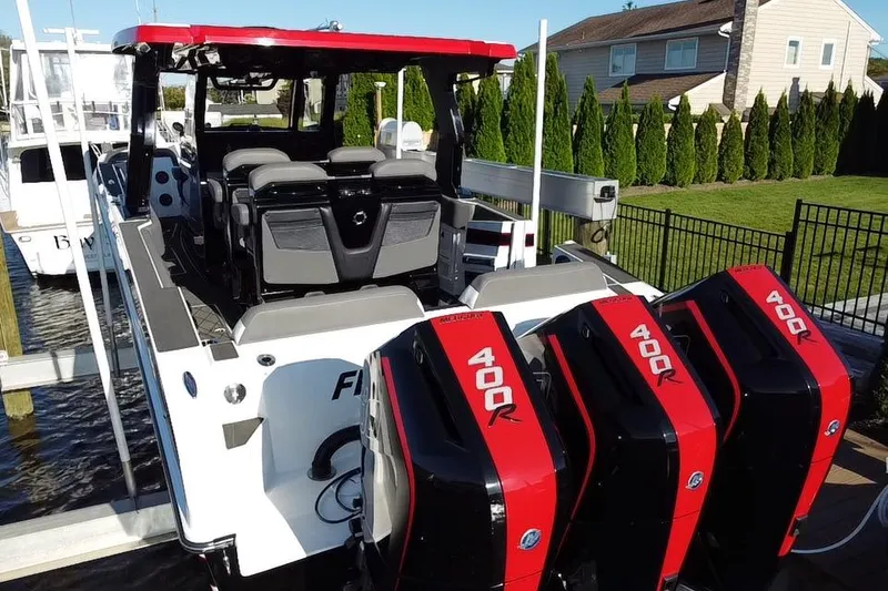 Slide: The Image of 2023 Fountain 38 SCX boat docked, featuring luxurious seating and modern design. - 13