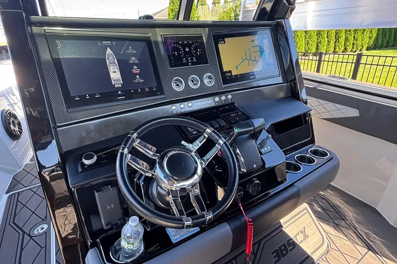 Slide: The Image of 2023 Fountain 38 SCX boat with triple 400R engines docked at marina. - 16