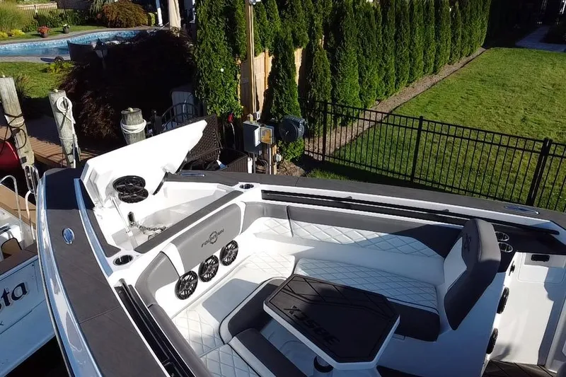 Slide: The Image of 2023 Fountain 38 SCX boat on trailer, featuring sleek design and "Final Phase" branding. - 2