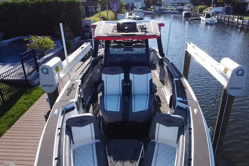 Slide: The Image of 2023 Fountain 38 SCX boat "Final Phase" on trailer, side view. - 3