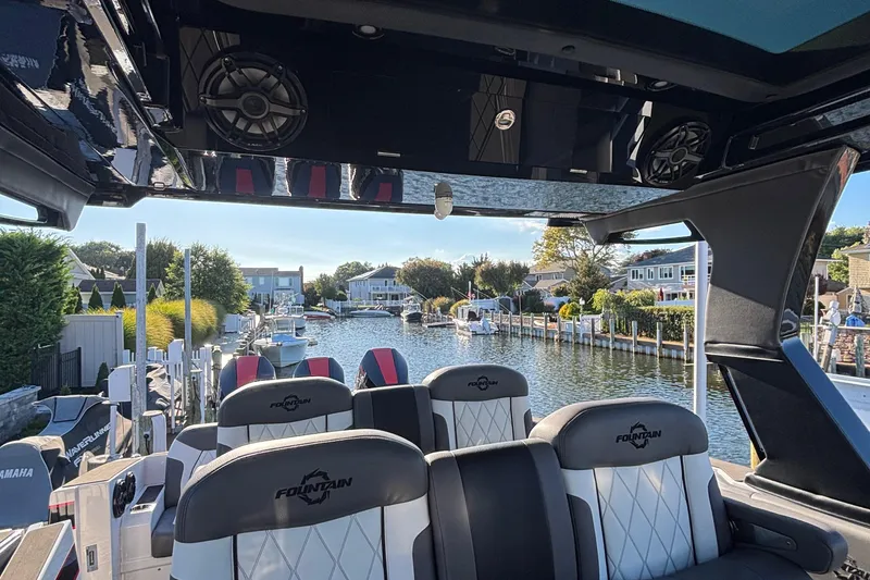 Slide: The Image of 2023 Fountain 38 SCX boat storage compartment open by the water. - 34