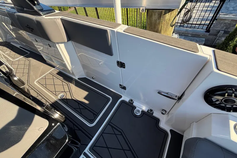 Slide: The Image of 2023 Fountain 38 SCX boat interior with cushioned seating and speakers. - 37