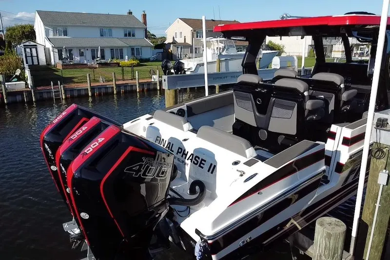 Slide: The Image of 2023 Fountain 38 SCX boat on trailer, featuring "Final Phase" graphics and triple 400 engines. - 4