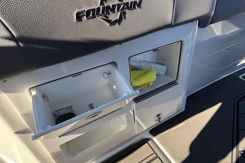 Slide: The Image of 2023 Fountain 38 SCX boat interior with canal view, featuring luxury seating and speakers. - 45