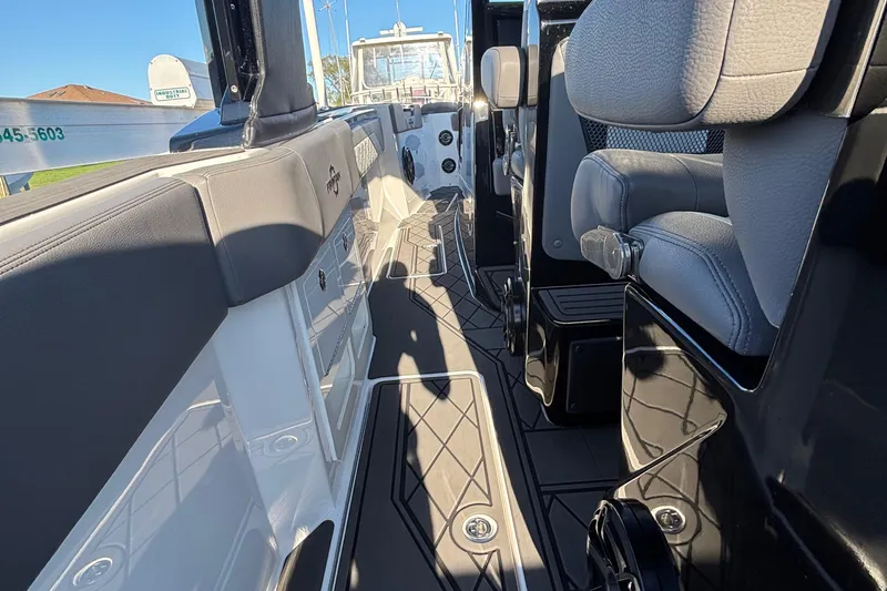 Slide: The Image of 2023 Fountain 38 SCX boat interior with control panel, sink, and towel holder. - 49