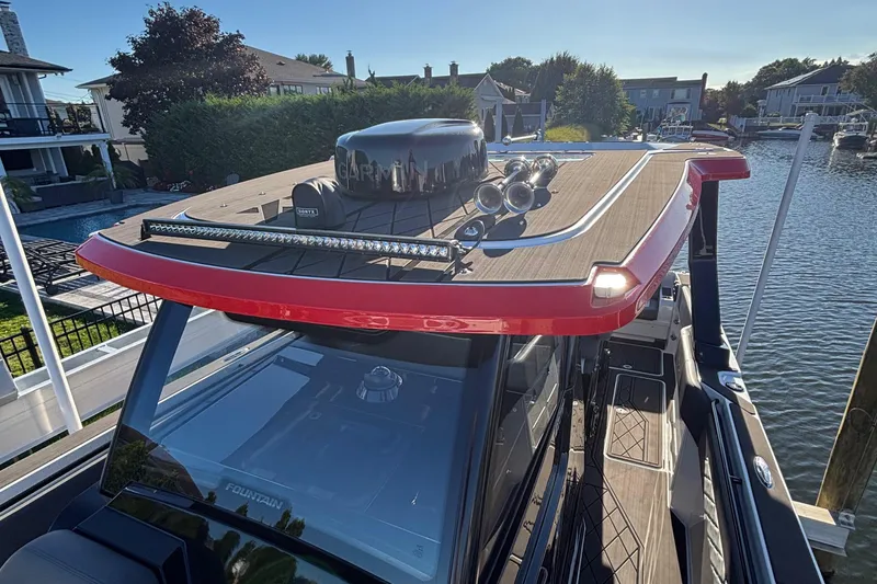 Slide: The Image of 2023 Fountain 38 SCX cabin interior with bed, sink, and storage basket. - 51