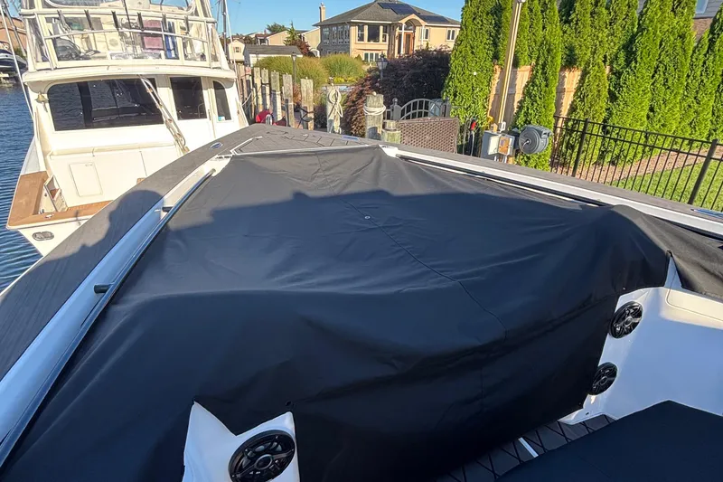 Slide: The Image of Interior view of 2023 Fountain 38 SCX boat with sleek seating and modern controls. - 52