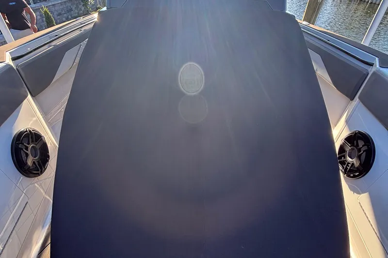 Slide: The Image of 2023 Fountain 38 SCX boat interior with waterfront view and luxury seating. - 54