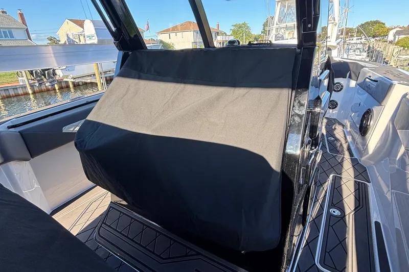 Slide: The Image of 2023 Fountain 38 SCX boat storage compartments with sleek design and chrome handles. - 55