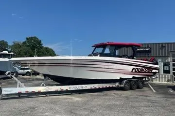 Slide: The Image of 2023 Fountain 38 SCX boat docked, showcasing sleek design and modern features. - 61