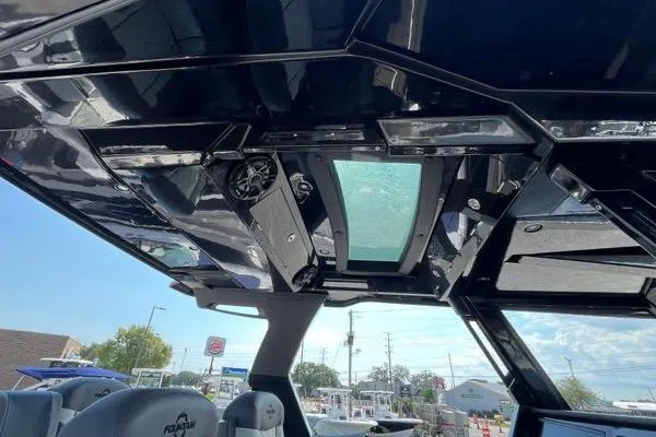 Slide: The Image of 2023 Fountain 38 SCX boat dashboard with modern navigation screens and controls. - 75