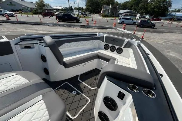 Slide: The Image of 2023 Fountain 38 SCX boat interior with sleek black console and modern controls. - 77