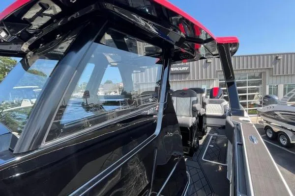 Slide: The Image of 2023 Fountain 38 SCX boat with sleek black design and modern interior. - 83