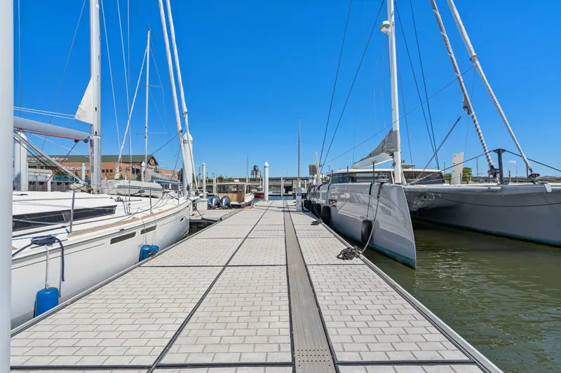 Slide: The Image of Interior of 2019 Itacatamarans 14.99, featuring modern wood paneling and cozy bedding. - 114