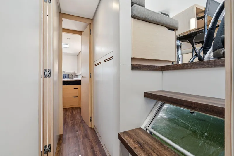 Slide: The Image of Cozy cabin interior of 2019 Itacatamarans 14.99 with modern bedding and window view. - 125