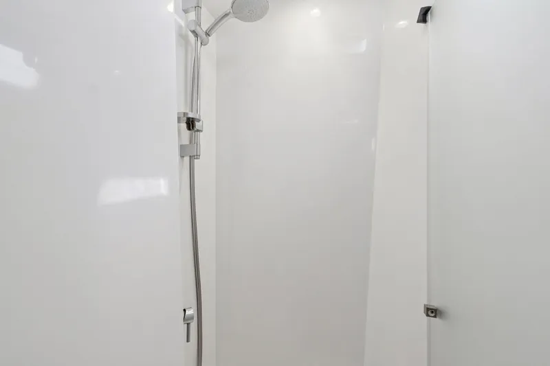 Slide: The Image of Open closet on Itacatamarans 14.99, featuring red jackets and a fire extinguisher, 2019 model. - 127