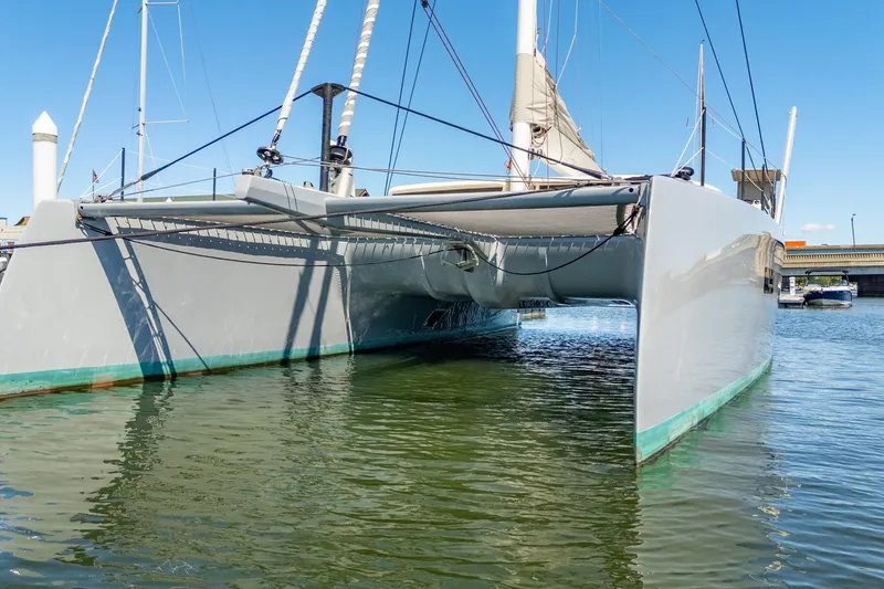 Slide: The Image of Steering wheel of 2019 Itacatamarans 14.99 at marina, sunny day. - 134