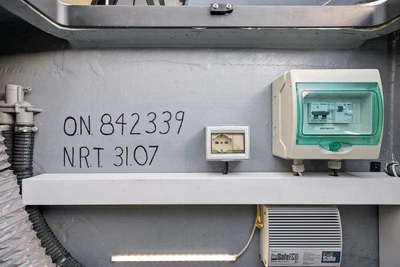 Slide: The Image of Open storage compartments on 2019 Itacatamarans 14.99 deck, containing tools and equipment. - 159