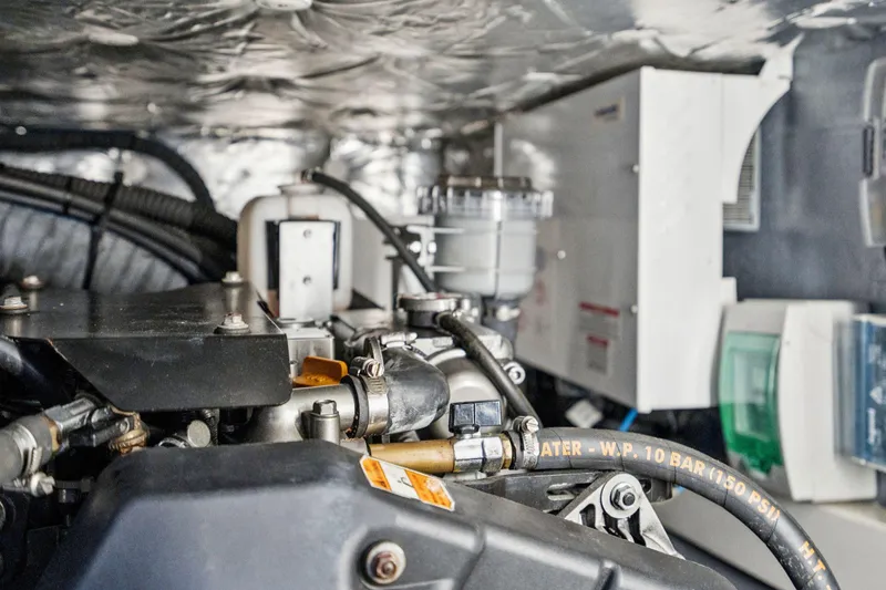 Slide: The Image of Open storage compartment on 2019 Itacatamarans 14.99 with life preserver and yellow containers. - 161