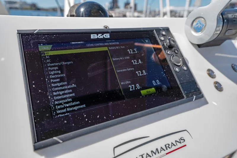 Slide: The Image of Engine room of 2019 Itacatamarans 14.99, showcasing mechanical components and wiring. - 165