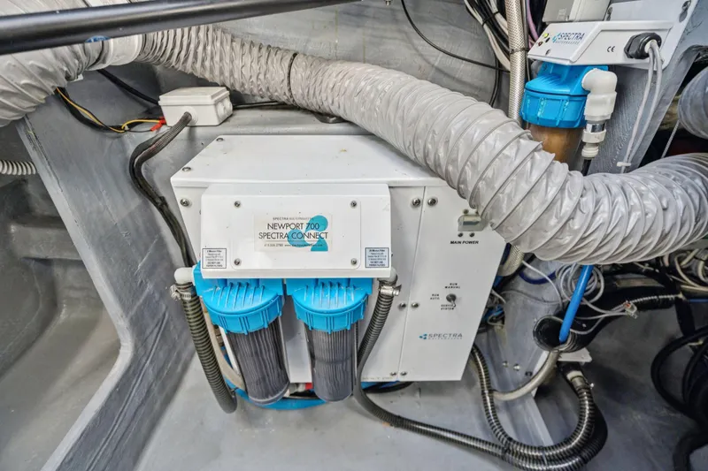 Slide: The Image of 2019 Itacatamarans 14.99 steering mechanism with cables and pulleys in a compartment. - 172