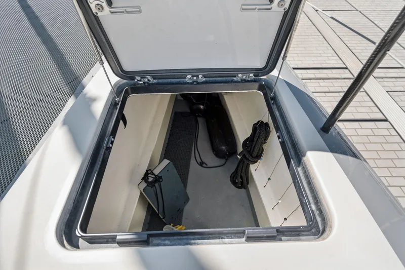 Slide: The Image of Under-seat storage in 2019 Itacatamarans 14.99, featuring battery and electrical components. - 187