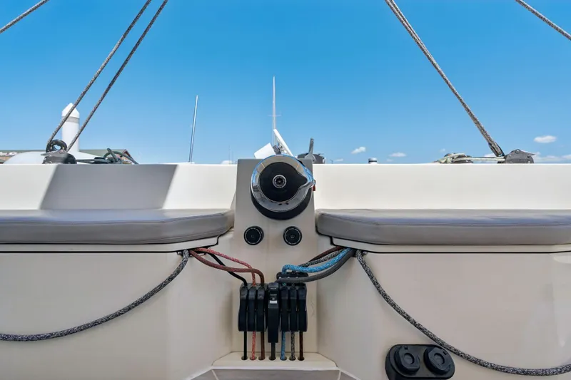 Slide: The Image of 2019 Itacatamarans 14.99 catamaran helm with ropes and winches on a sunny day. - 22