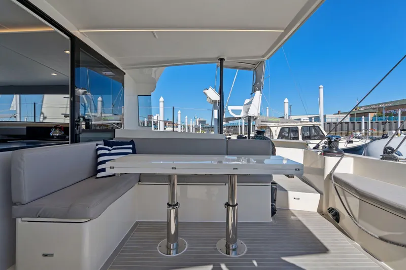 Slide: The Image of 2019 Itacatamarans 14.99 yacht interior with modern seating and navigation equipment. - 26