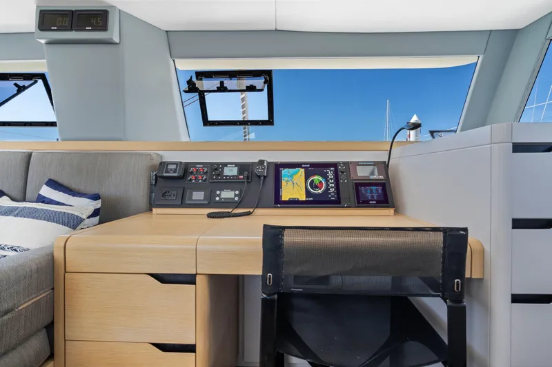 Slide: The Image of Steering wheel of 2019 Itacatamarans 14.99 catamaran docked at marina. - 39