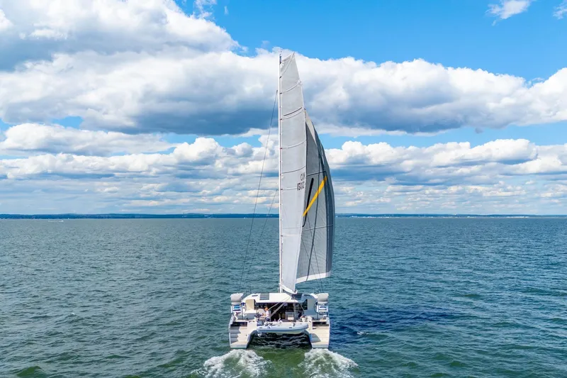 Slide: The Image of 2019 Itacatamarans 14.99 sailing on open sea under clear blue sky. - 4