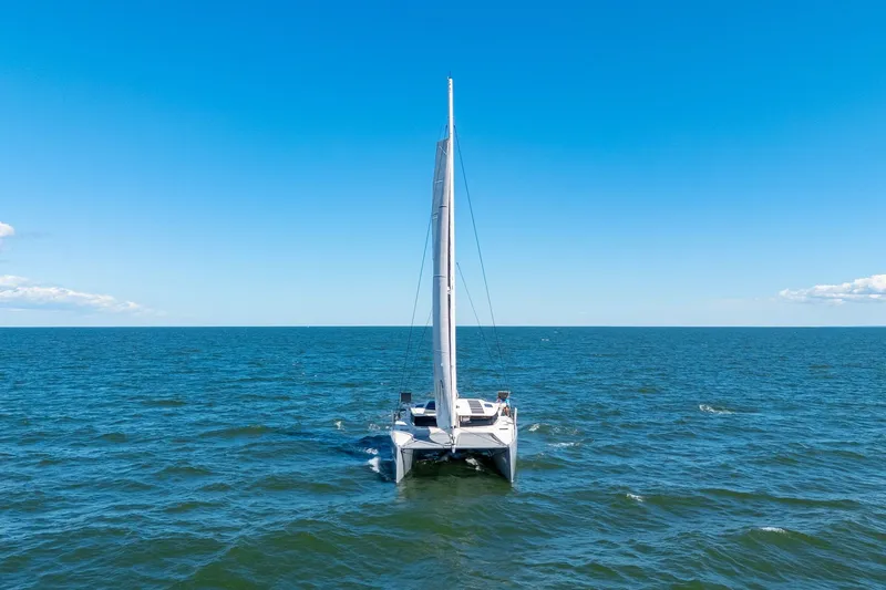 Slide: The Image of 2019 Itacatamarans 14.99 sailing on open sea under clear blue sky. - 8