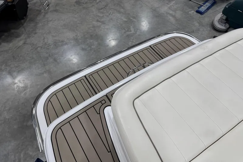 Slide: The Image of 2007 Cobalt 323 boat interior with beige seating and teak-style flooring. - 10