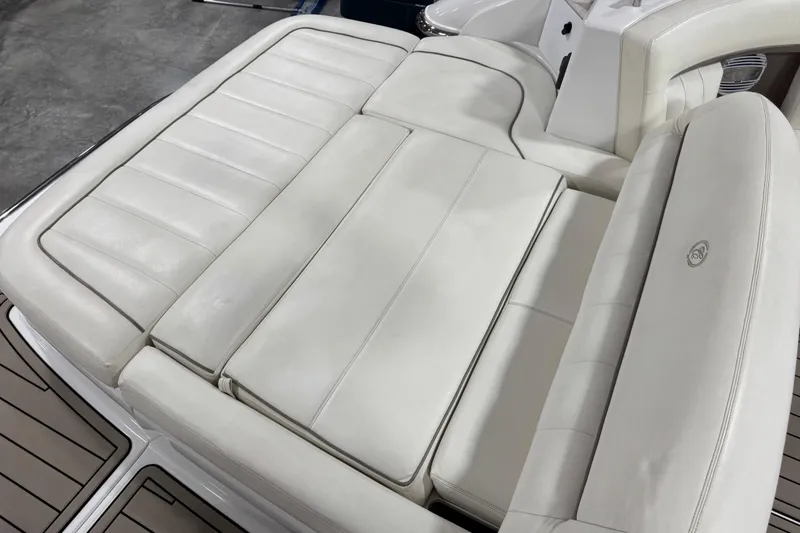 Slide: The Image of White leather seating on a 2007 Cobalt 323 boat, showcasing luxury and comfort. - 11