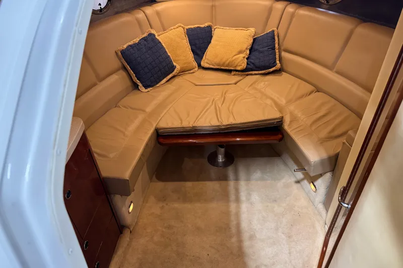 Slide: The Image of Luxurious 2007 Cobalt 323 cabin interior with beige seating and decorative cushions. - 13