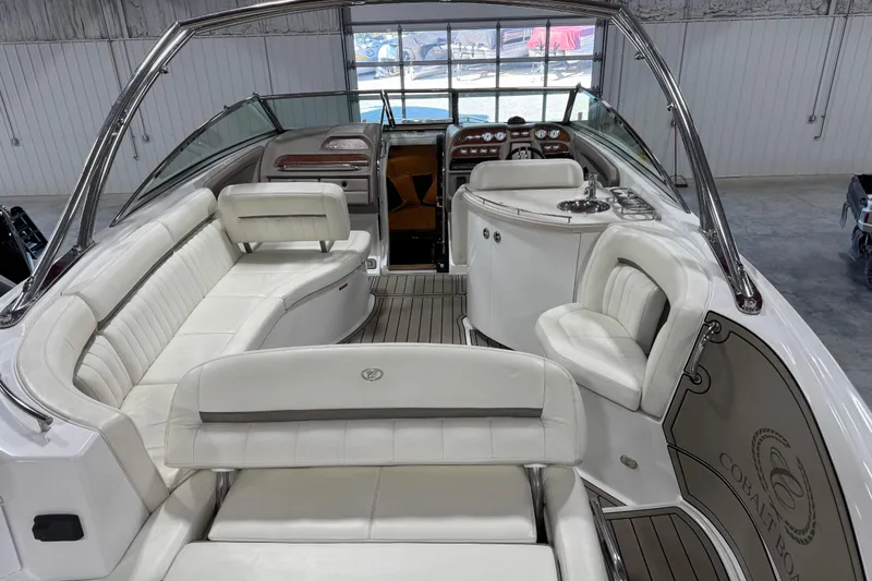 Slide: The Image of Luxurious interior of a 2007 Cobalt 323 boat with white leather seating and sleek design. - 9