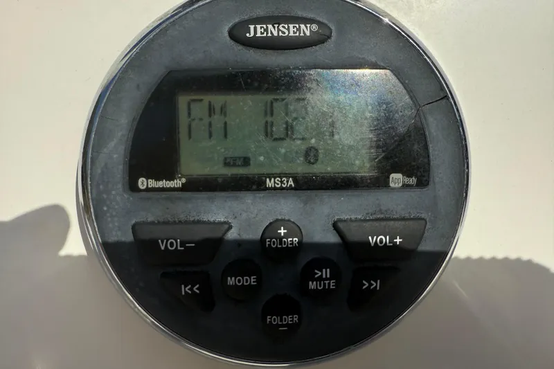 Slide: The Image of Jensen MS3A radio on 2016 Robalo R160 Center Console boat dashboard. - 10